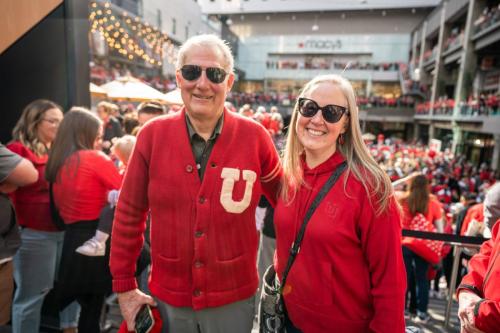 VP Lori McDonald and her father cheer on Utah Football. 
